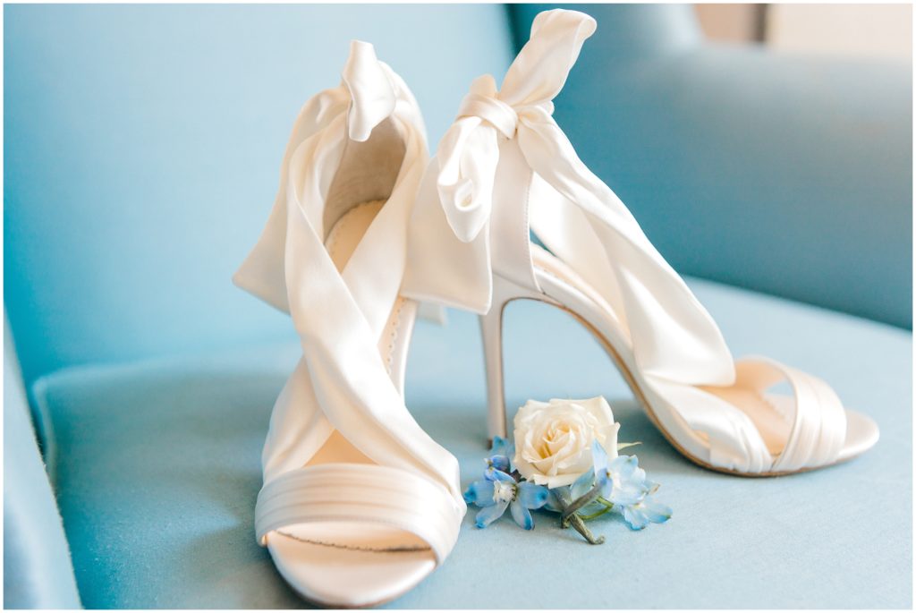 White wedding shoes on blue background