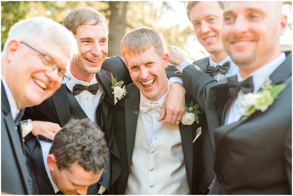 Groom with friends laughing