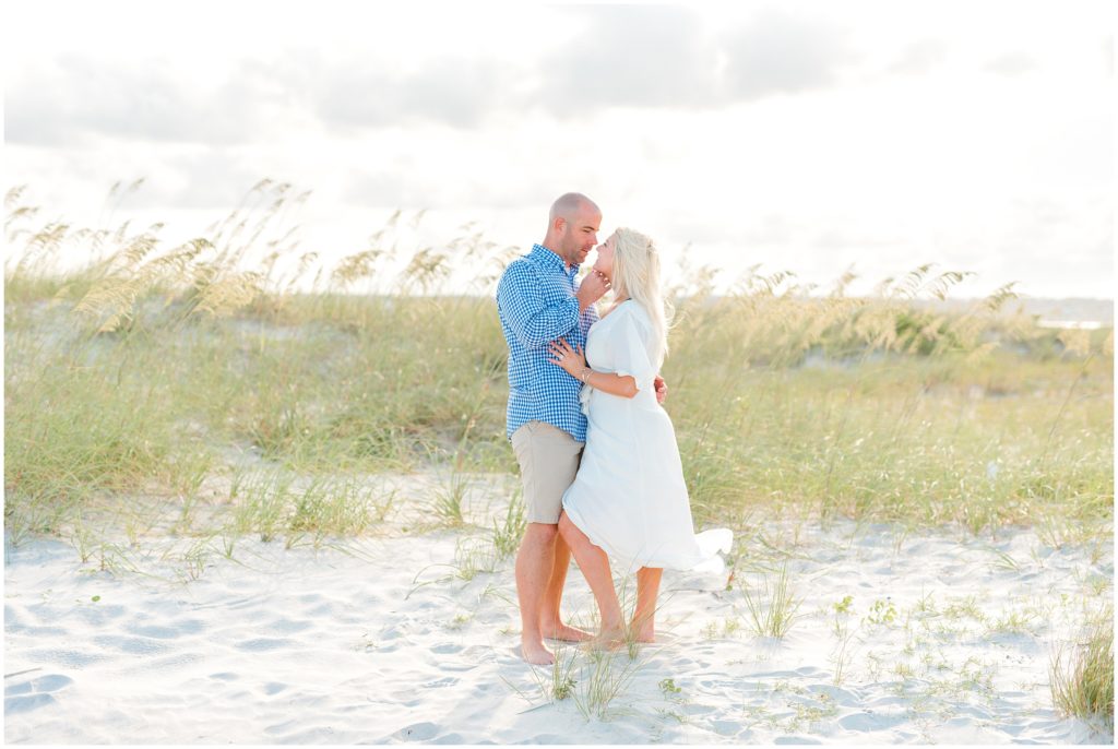 Wilmington Engagement Session couple snuggling on beach