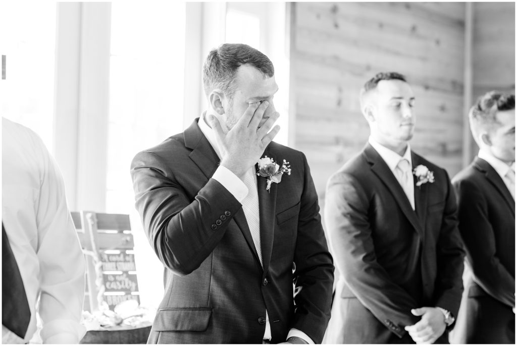 Groom crying seeing bride at ceremony | Carolina Barn, Spring Lake NC | by Kaitlyn Blake Photography