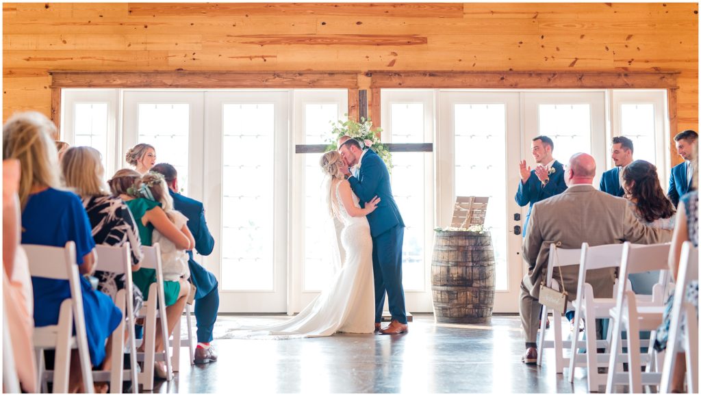 Wedding ceremony first kiss | Carolina Barn, Spring Lake NC | by Kaitlyn Blake Photography