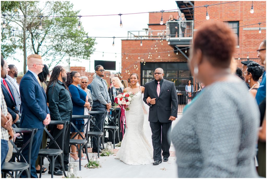 Bride Walking Down Aisle | The Firehouse Goldsboro Wedding | by Kaitlyn Blake Photography | Fall Elegant Wedding 