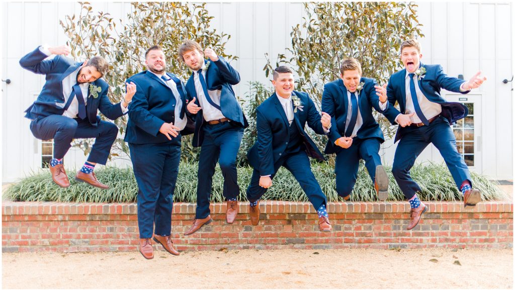 Groom and Groomsmen Navy Suits Jumping | The Barn of Chapel Hill | by Kaitlyn Blake Photography | Fall Elegant Wedding 