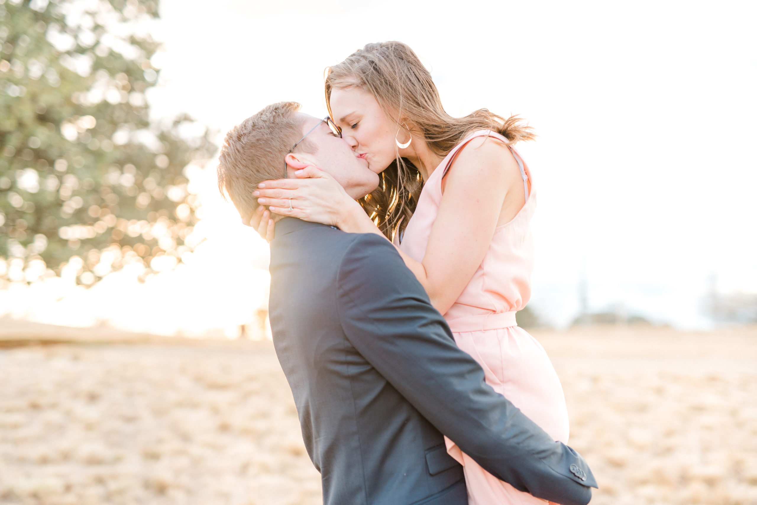 couple kissing at spring engagement session raleigh north carolina