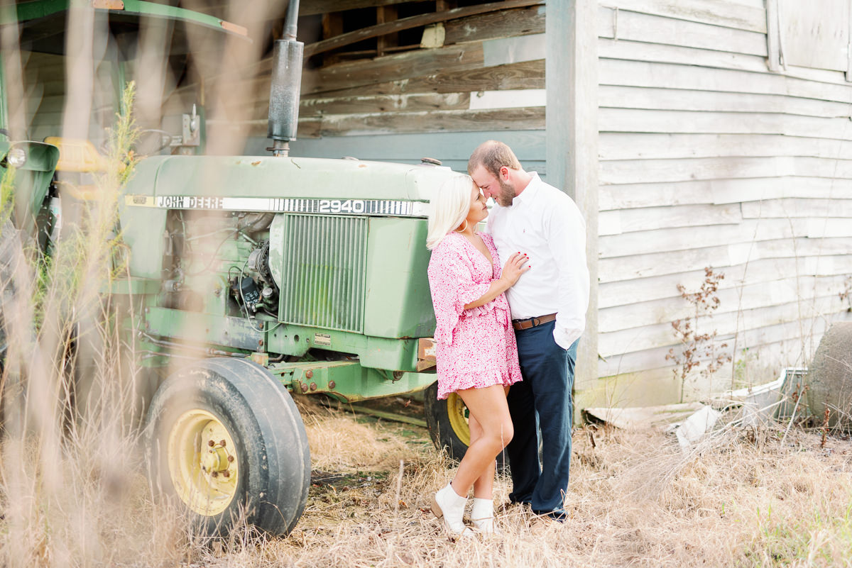 tarboro farm engagement session with tractor and couple